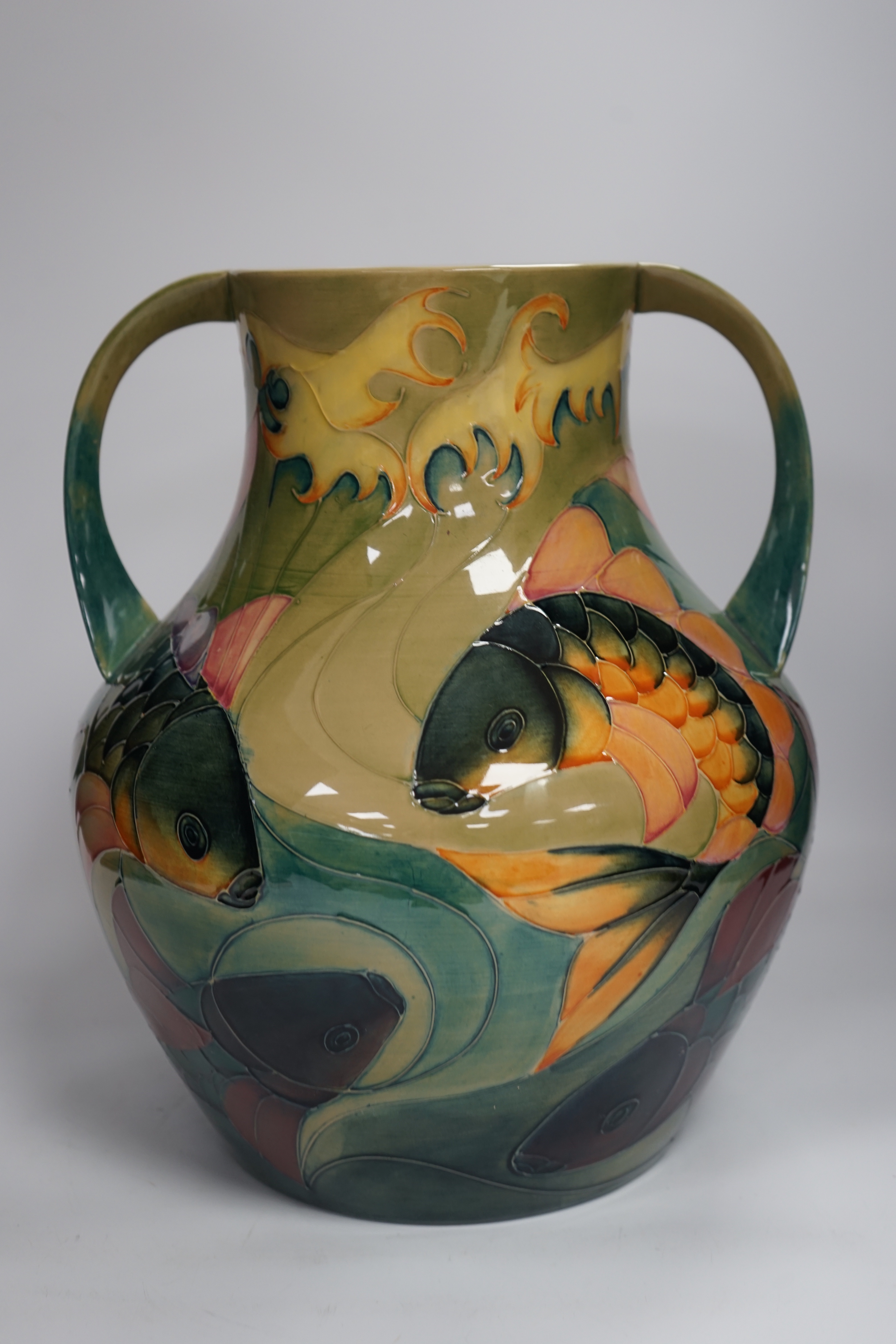 A large Moorcroft twin-handled 'carp' vase, designed by Sally Tuffin, 33cm high